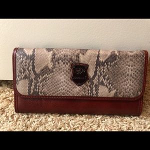 Hand wallet maroon colored with animal print on front